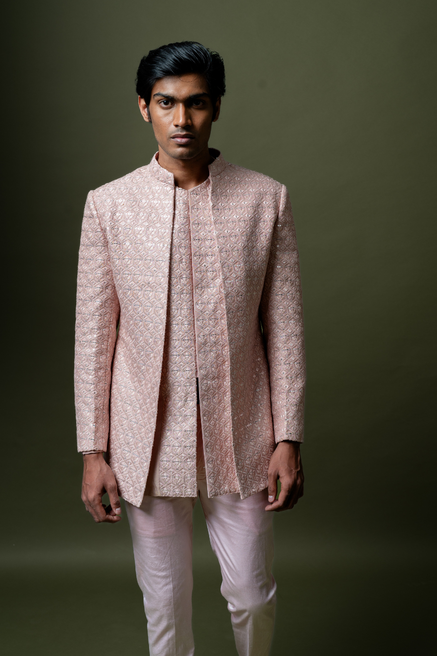 Blush pink embroidered Jodhpuri suit set styled for groom’s muhurtham or pellikoduku event.