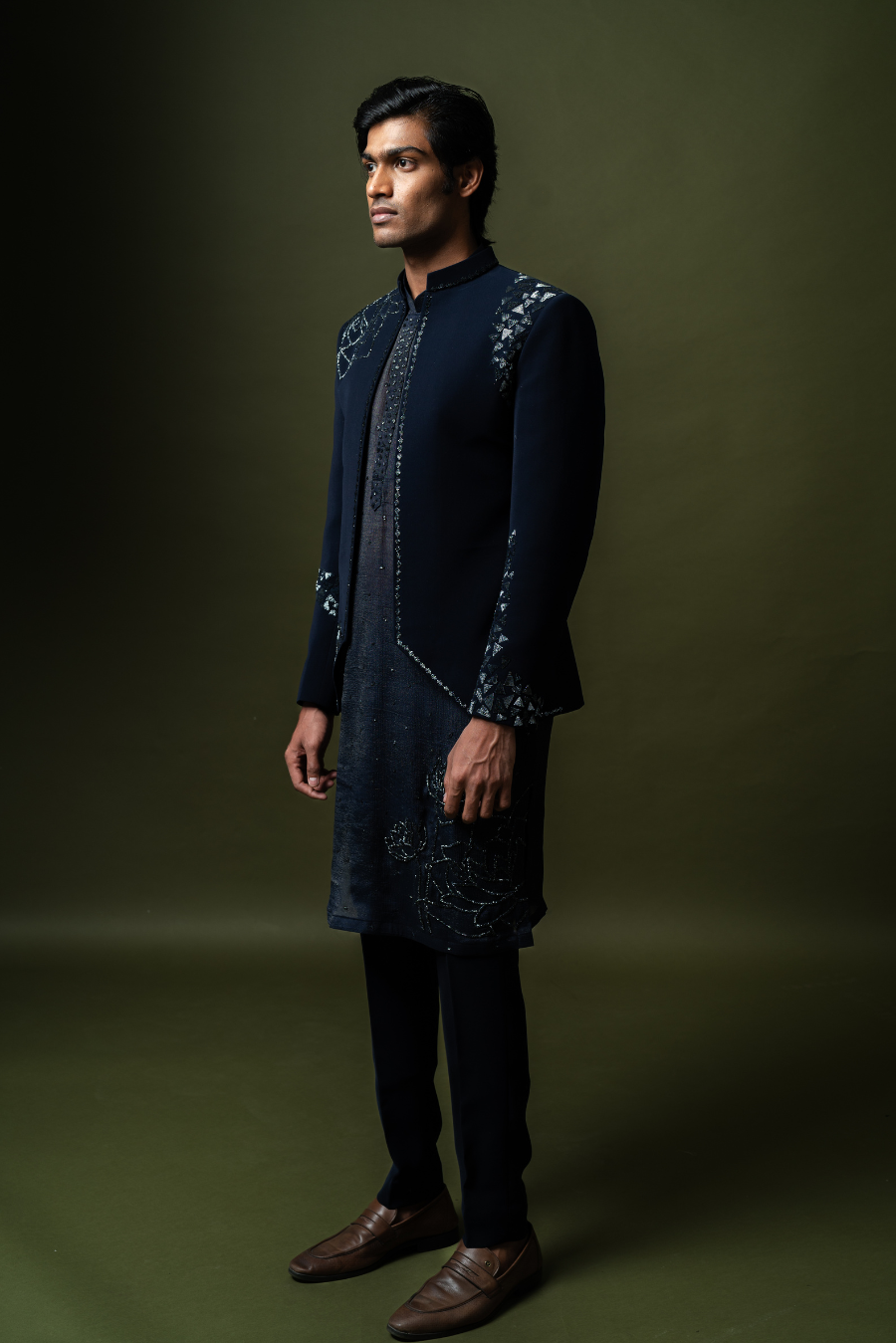 Traditional navy Jodhpuri suit with embroidery on shoulder and sleeves, styled for South Indian weddings.