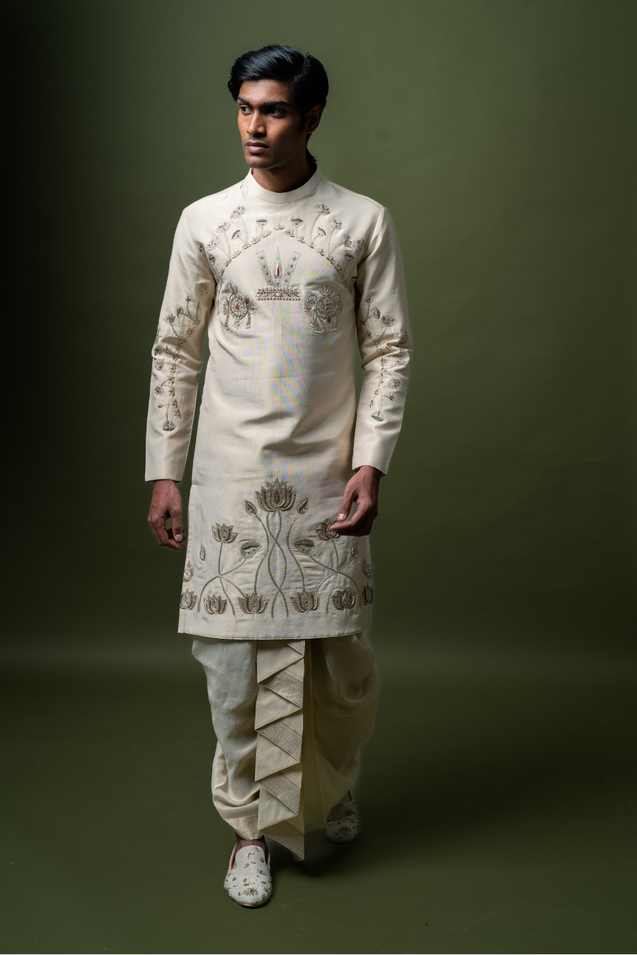 Cream embroidered kurta with lotus motifs and pleated churidar – stylish men’s traditional Indian outfit