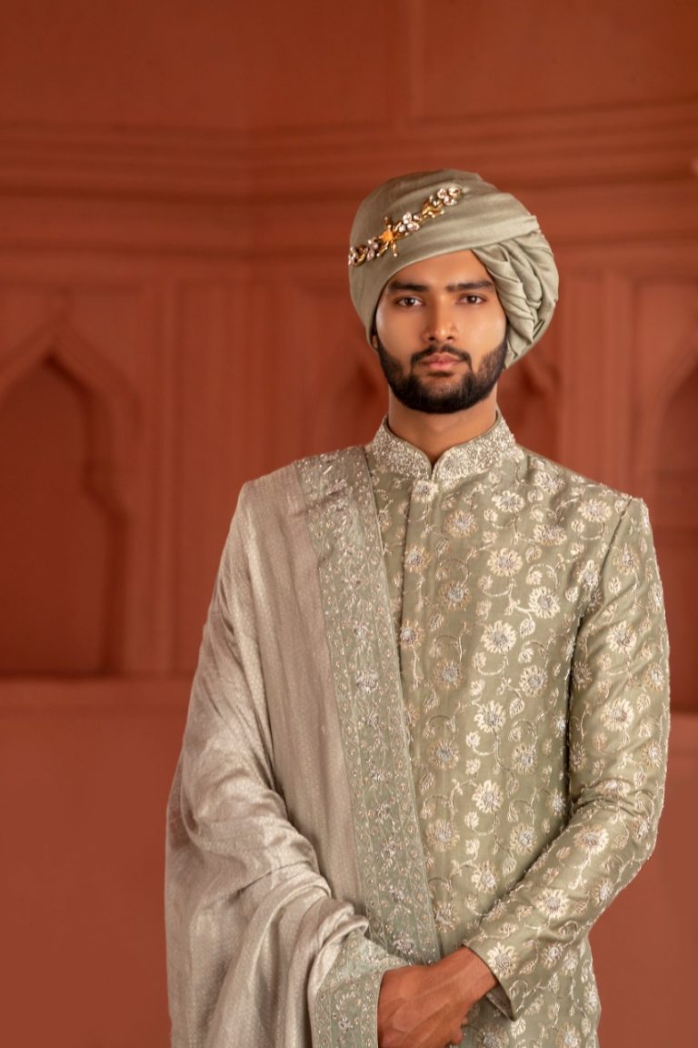 South Indian groom dressed in pastel sage green hand-embroidered Pattu Sherwani with matching dupatta and turban, perfect for wedding, Muhurtham, and Pellikoduku in Hyderabad.