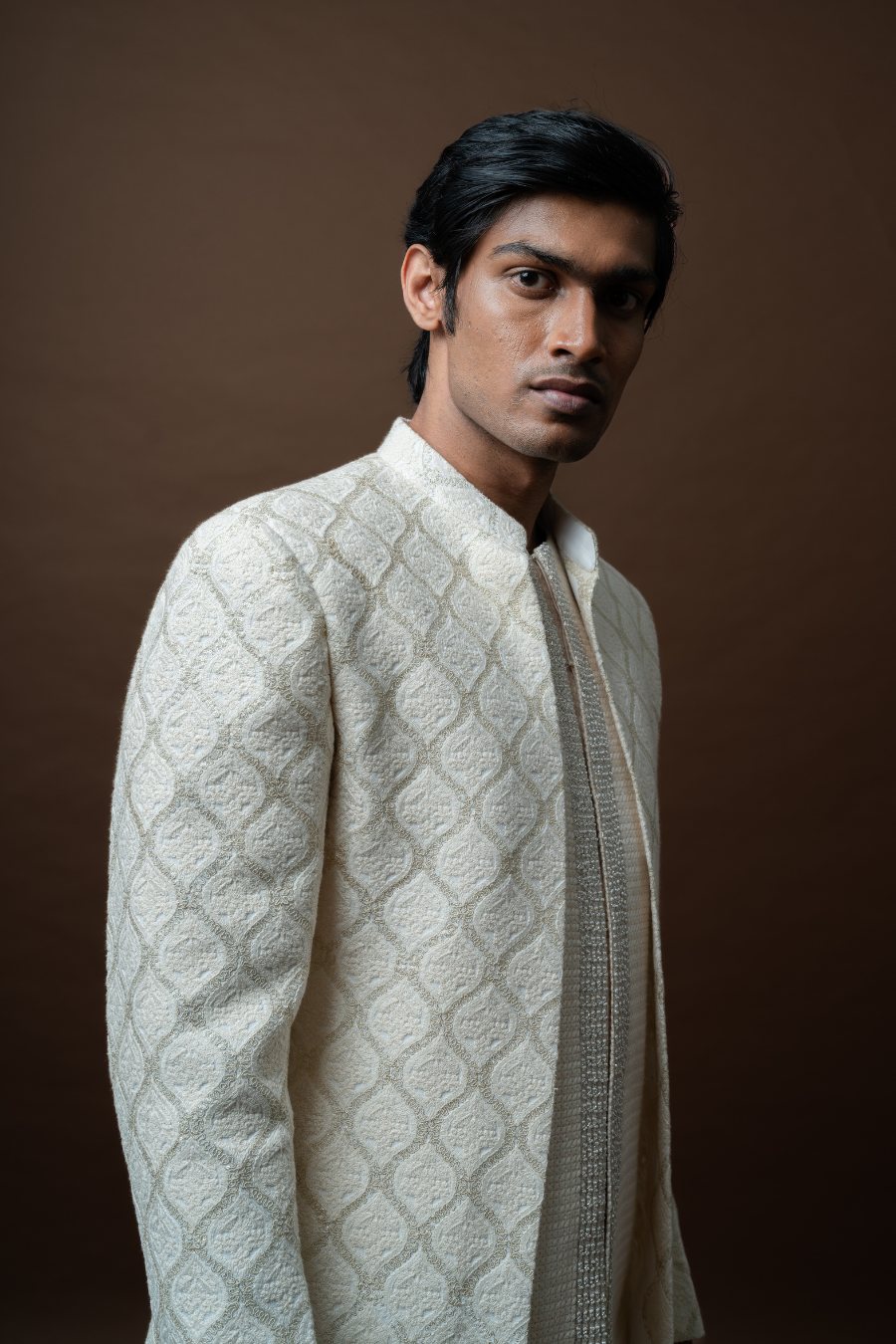 Ivory ethnic Jodhpuri set worn by a groom, ideal for engagement, reception, or haldi ceremony.