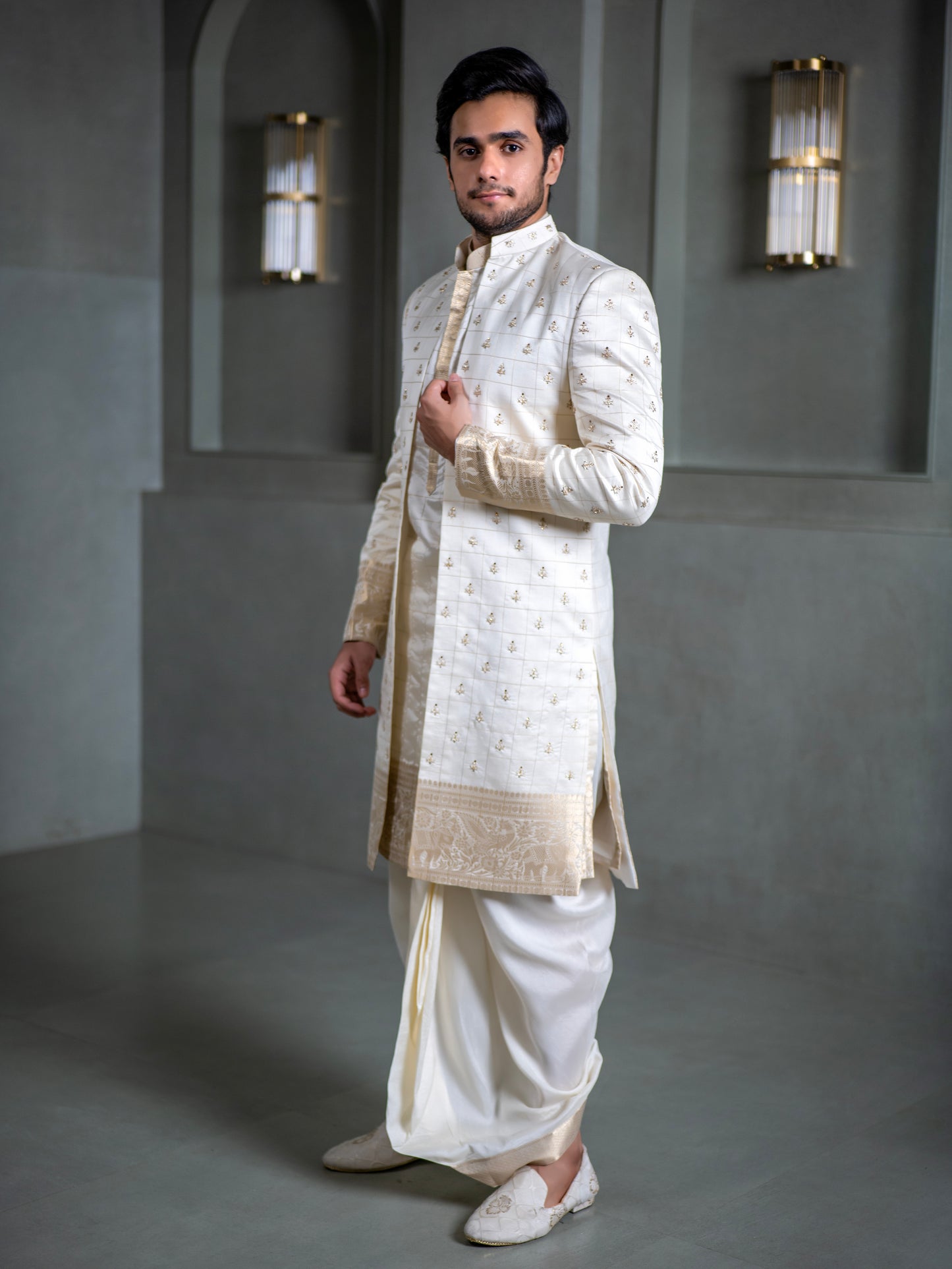 South Indian groom in ivory pattu sherwani with embroidered detailing and dhoti, perfect for Muhurtham and wedding in Hyderabad