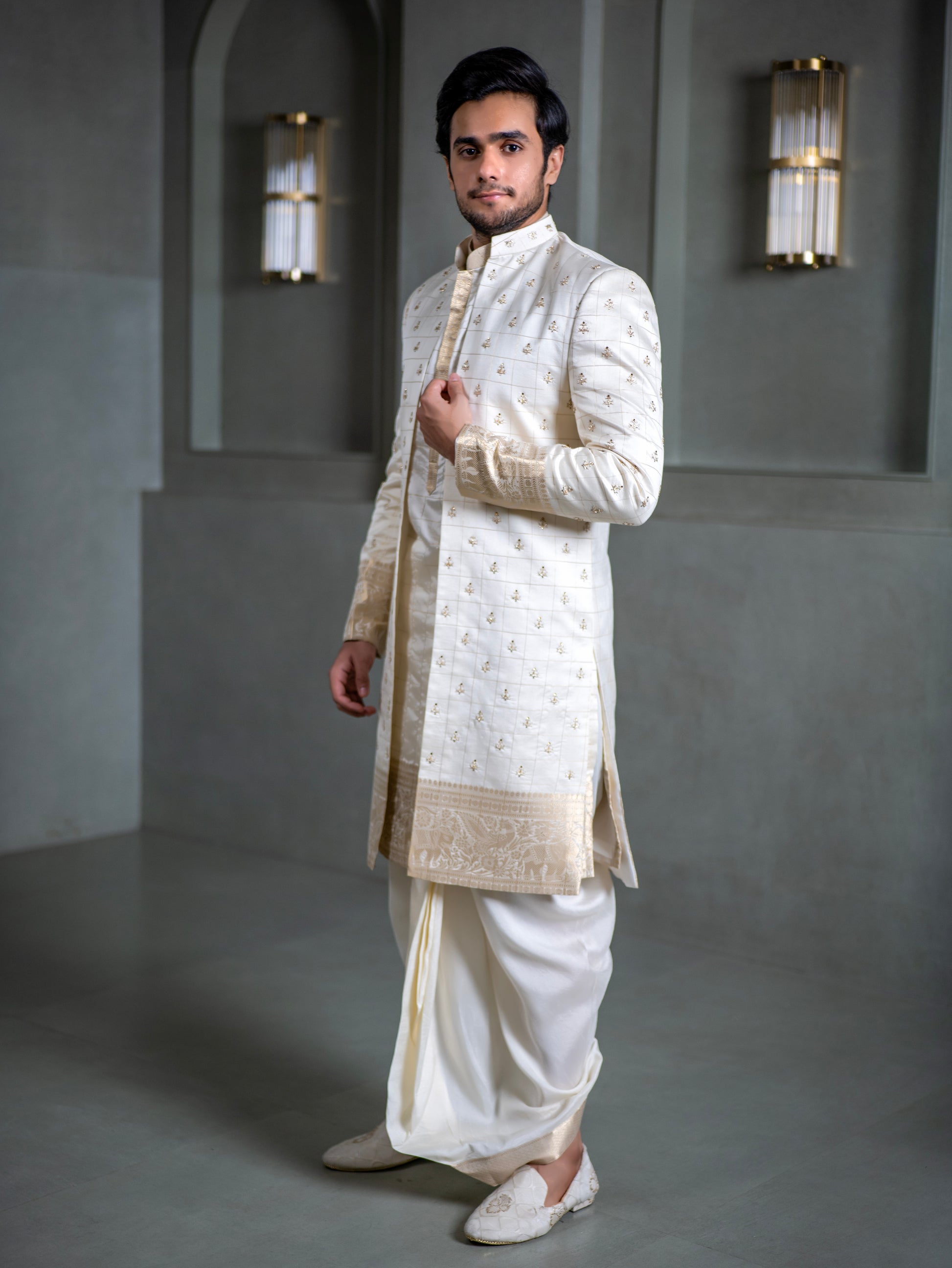 South Indian groom in ivory pattu sherwani with embroidered detailing and dhoti, perfect for Muhurtham and wedding in Hyderabad