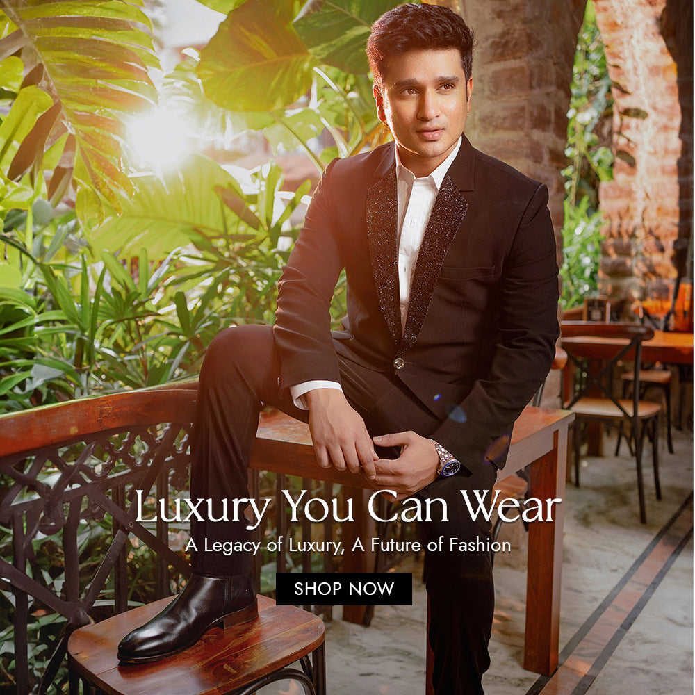 Tailored black suit for South Indian groom – reception and engagement outfit by Tejas Harish Hyderabad
